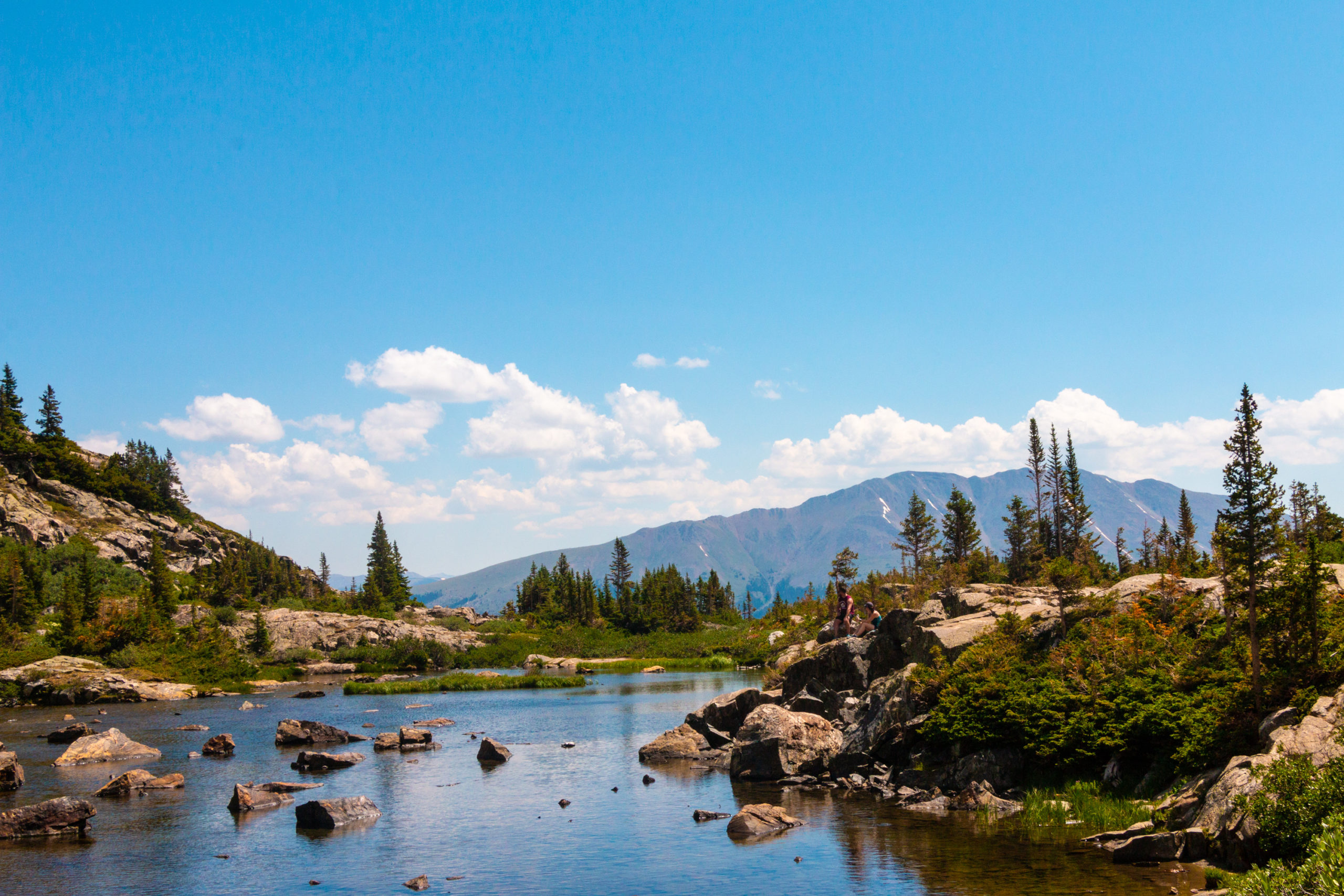 Breckenridge stream in the Spring with a bright blue sky