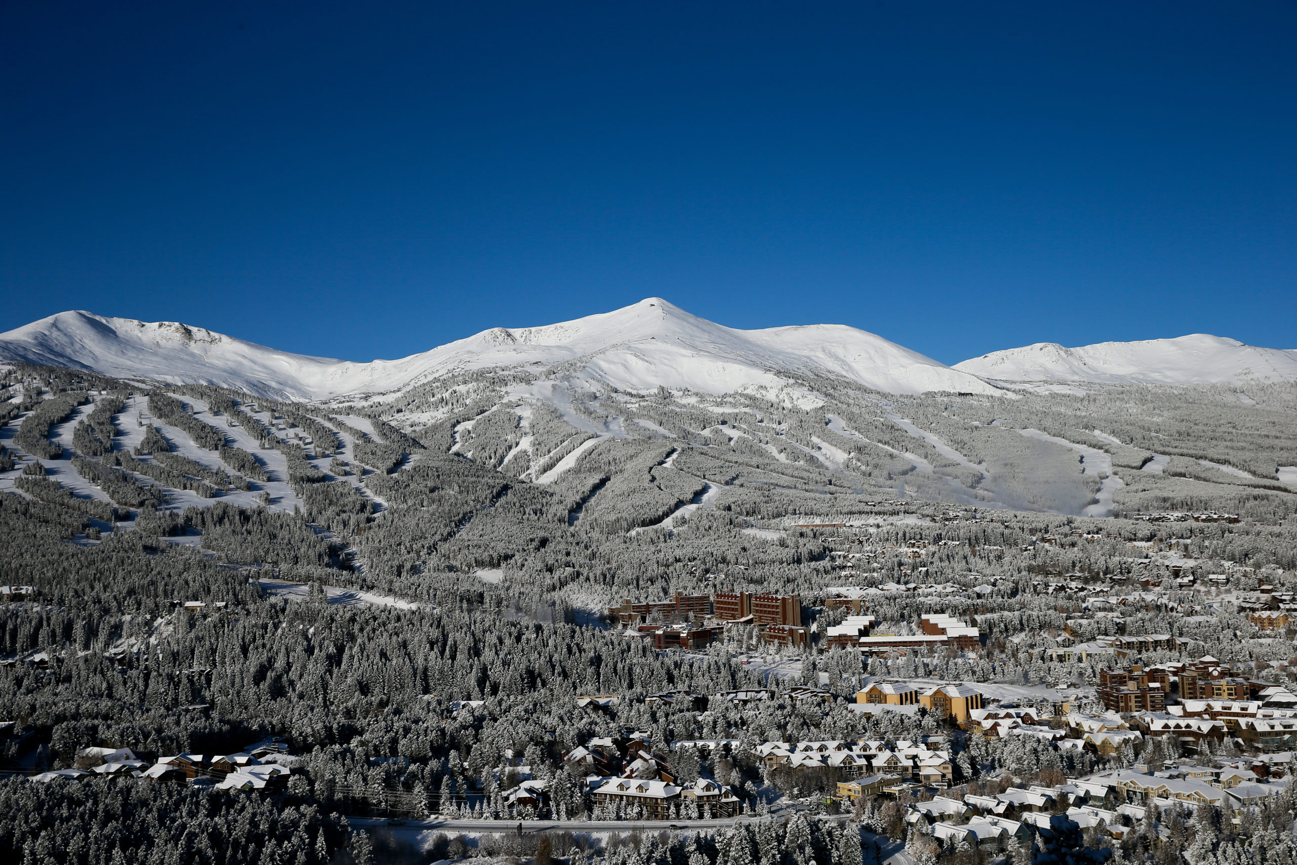 Breckenridge Town and Mountain with winter snow. - Image by Austyn Dineen