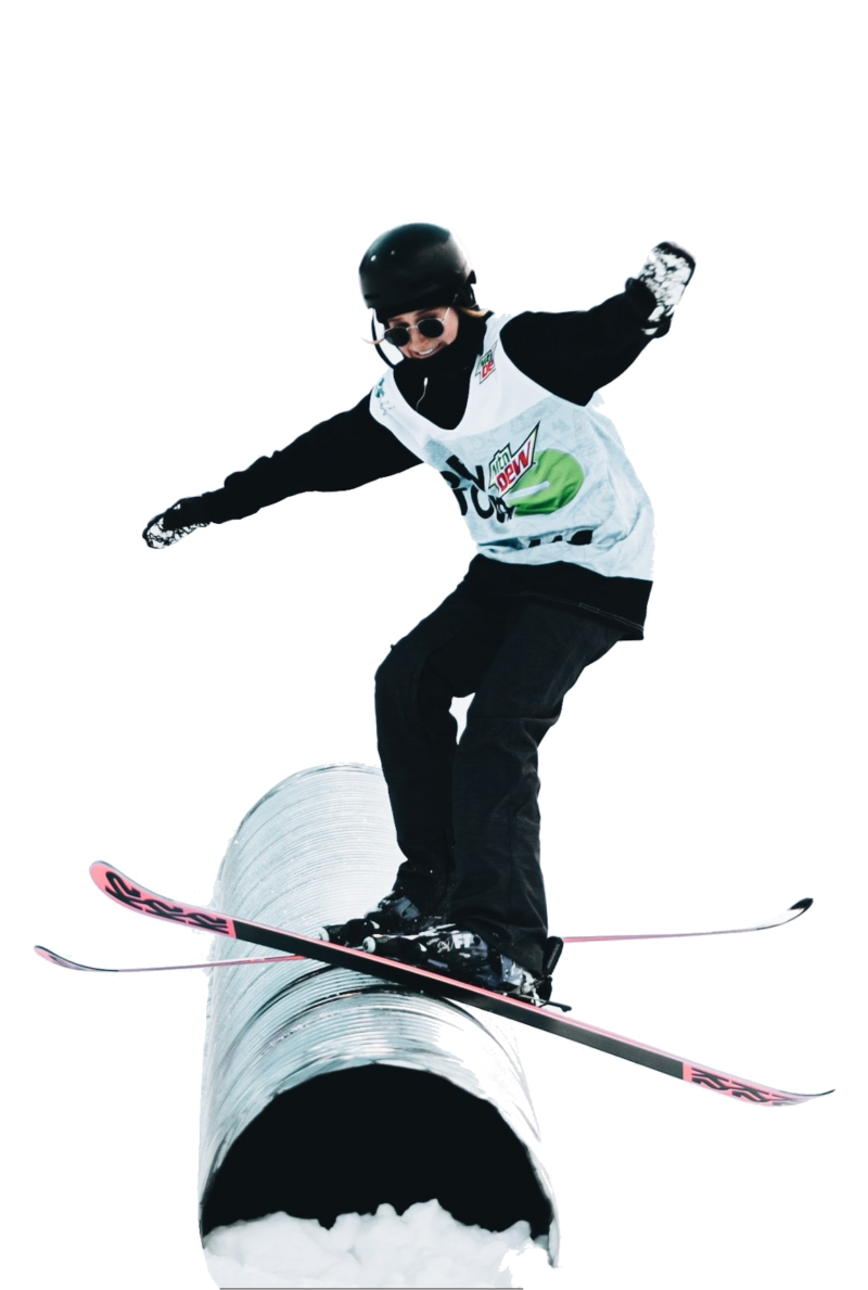 Skier hitting a rail on demo skis