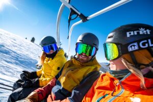 smiling from chairlift, spring skiing