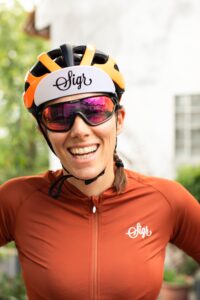 woman wearing bike helmet and sporty sunglasses